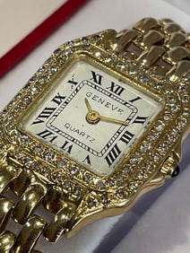 14K GOLD GENEVE 0.75Ct DIAMOND BEZEL WHITE ROMAN DIAL SWISS QUARTZ STATEMENT WATCH    With a Swiss