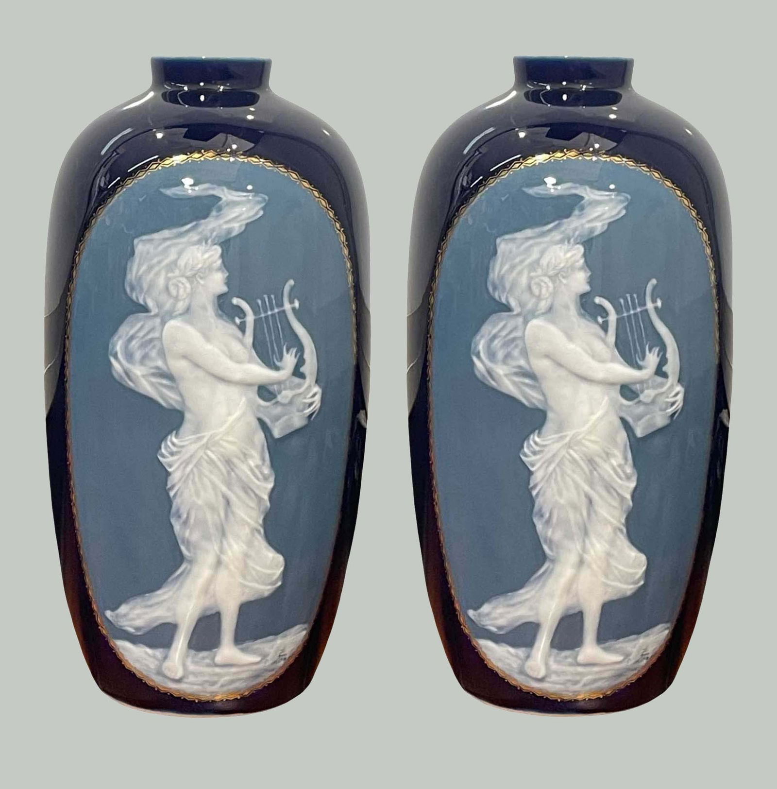 PAIR OF CAMILLE THARAUD (LIMOGES, FRANCE) PATE-SUR-PATE PORCELAIN VASES Females playing harp on: PAIR OF CAMILLE THARAUD (LIMOGES, FRANCE) PATE-SUR-PATE PORCELAIN VASESFemales playing harp on cobalt blue ground early 20th century (circa 1925) porcelain marked ''Tharaud/Limoges, France'' 11 1/2 x