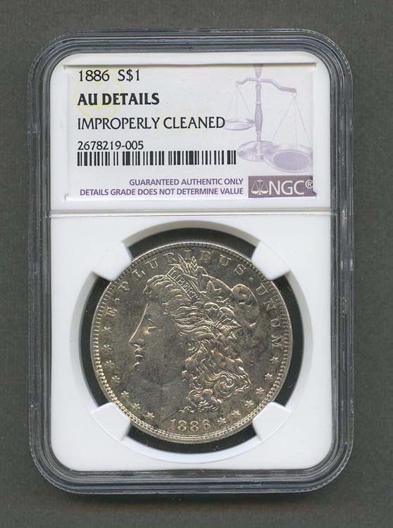 1886 $1 AU DETAILS IMPROPERLY CLEANED NGC GRADED MORGAN SILVER DOLLAR KEY DATE COIN Other: 1886 $1 AU DETAILS IMPROPERLY CLEANED NGC GRADED MORGAN SILVER DOLLAR KEY DATE COIN Other Notes: Kotler's Auction Gallery can arrange shipping for this item.