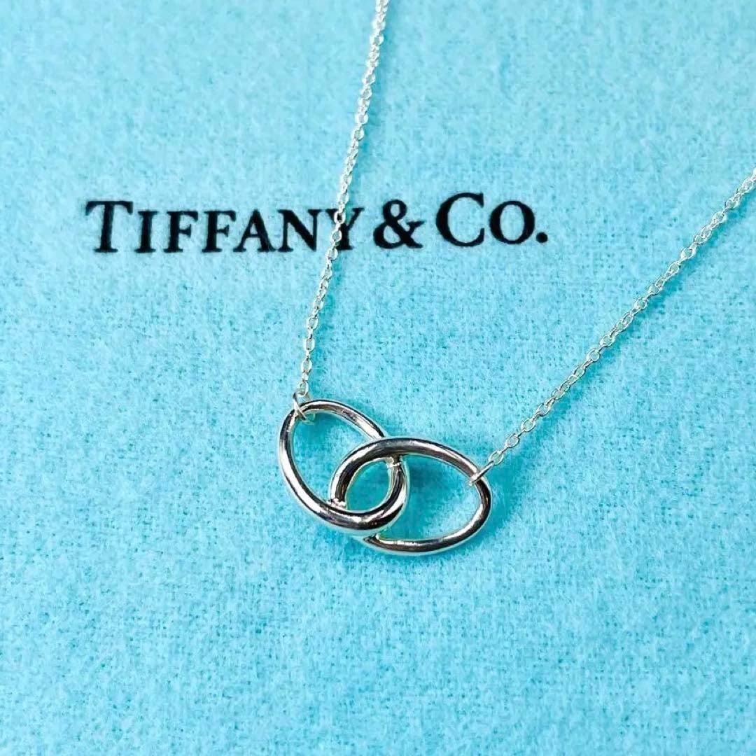 TIFFANY AND CO DOUBLE LOOP ELSA PERETTI NECKLACE IN STERLING SILVER w/ Pouch with Box & Pouch,: TIFFANY AND CO DOUBLE LOOP ELSA PERETTI NECKLACE IN STERLING SILVER w/ Pouch with Box & Pouch, Ribbon and Care Card, hallmarked ''T & Co. (C) PERETTI 925'', comes pre-polished with the turquoise Tiffa