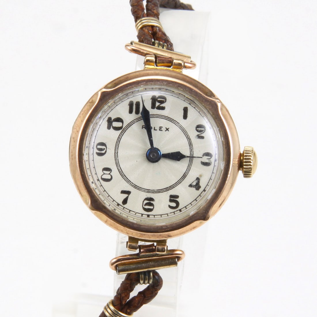 ROLEX CIRCA 1940s 9CT. 375 LADIES SWISS 15J CORDED LEATHER WATCH Brand: Rolex Ref: Circa 1940s: ROLEX CIRCA 1940s 9CT. 375 LADIES SWISS 15J CORDED LEATHER WATCH Brand: Rolex Ref: Circa 1940s Model: 9ct. 375 Serial: 198**** Gender: Ladies Movement: Swiss Automatic 15J Crystal Type: Acrylic Case M