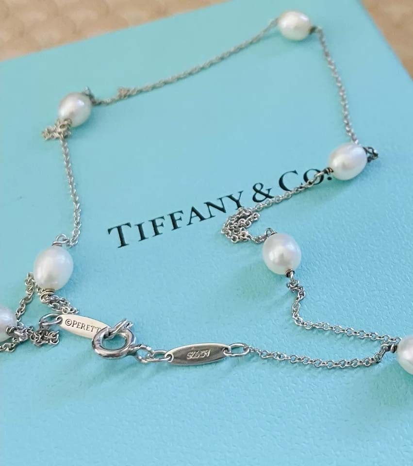 TIFFANY Co. SILVER ELSA PERETTI PEARL By The YARD OPRA LENGTH NECKLACE 37.5 In. Marked ''Tiffany: TIFFANY Co. SILVER ELSA PERETTI PEARL By The YARD OPRA LENGTH NECKLACE 37.5 In. Marked ''Tiffany & Co. PERETTI 925'' features 14 freshwater pearls of matching oval shape, size 6.50-6.60 mm, matching l
