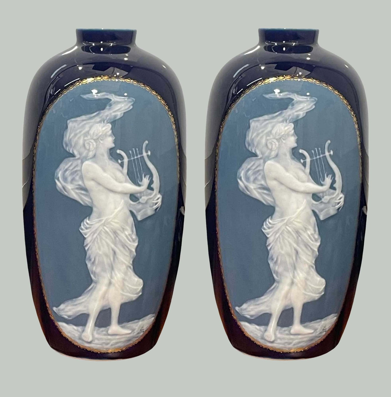 PAIR OF CAMILLE THARAUD (LIMOGES, FRANCE) PATE-SUR-PATE PORCELAIN VASES Females playing harp on: PAIR OF CAMILLE THARAUD (LIMOGES, FRANCE) PATE-SUR-PATE PORCELAIN VASES Females playing harp on cobalt blue ground early 20th century (circa 1925) porcelain marked ''Tharaud/Limoges, France'' 11 1/2 x