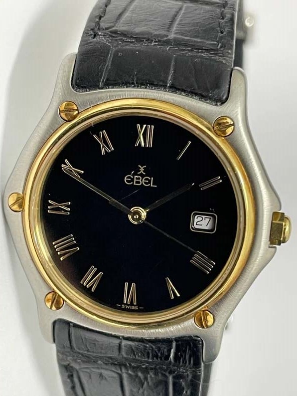EBEL 183909 SPORT WAVE CLASSIC IN 18K GOLD/SS W BLACK ROMAN NUMERAL DATE WATCH, UNISEX ref.: EBEL 183909 SPORT WAVE CLASSIC IN 18K GOLD/SS W BLACK ROMAN NUMERAL DATE WATCH, UNISEX ref. 183909 with a Swiss quartz movement, ultra-Thin water resistant screw down brushed finish case, hexagonal cr