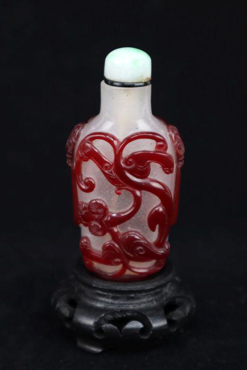 Chinese Snuff Bottle, Red And White Glass, 3.5"H With Stand, Dragon Relief, Top Tested As Stone: Chinese Snuff Bottle, Red And White Glass, 3.5"H With Stand, Dragon Relief, Top Tested As Stone Estimate $10-100