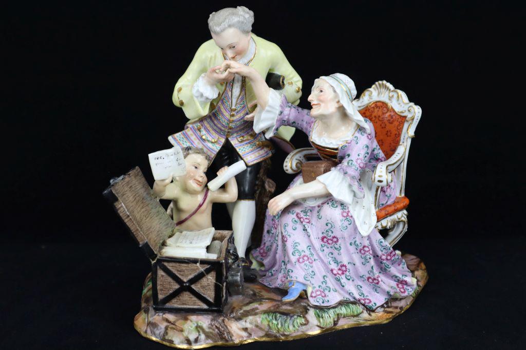 Meissen Porcelain Figurine, Rich Old Woman With Young Lover, Marked Cross Swords And "A46", Repaired: Meissen Porcelain Figurine, Rich Old Woman With Young Lover, Marked Cross Swords And "A46", Repaired At Trunk, 6X5.5"H Estimate $10-100
