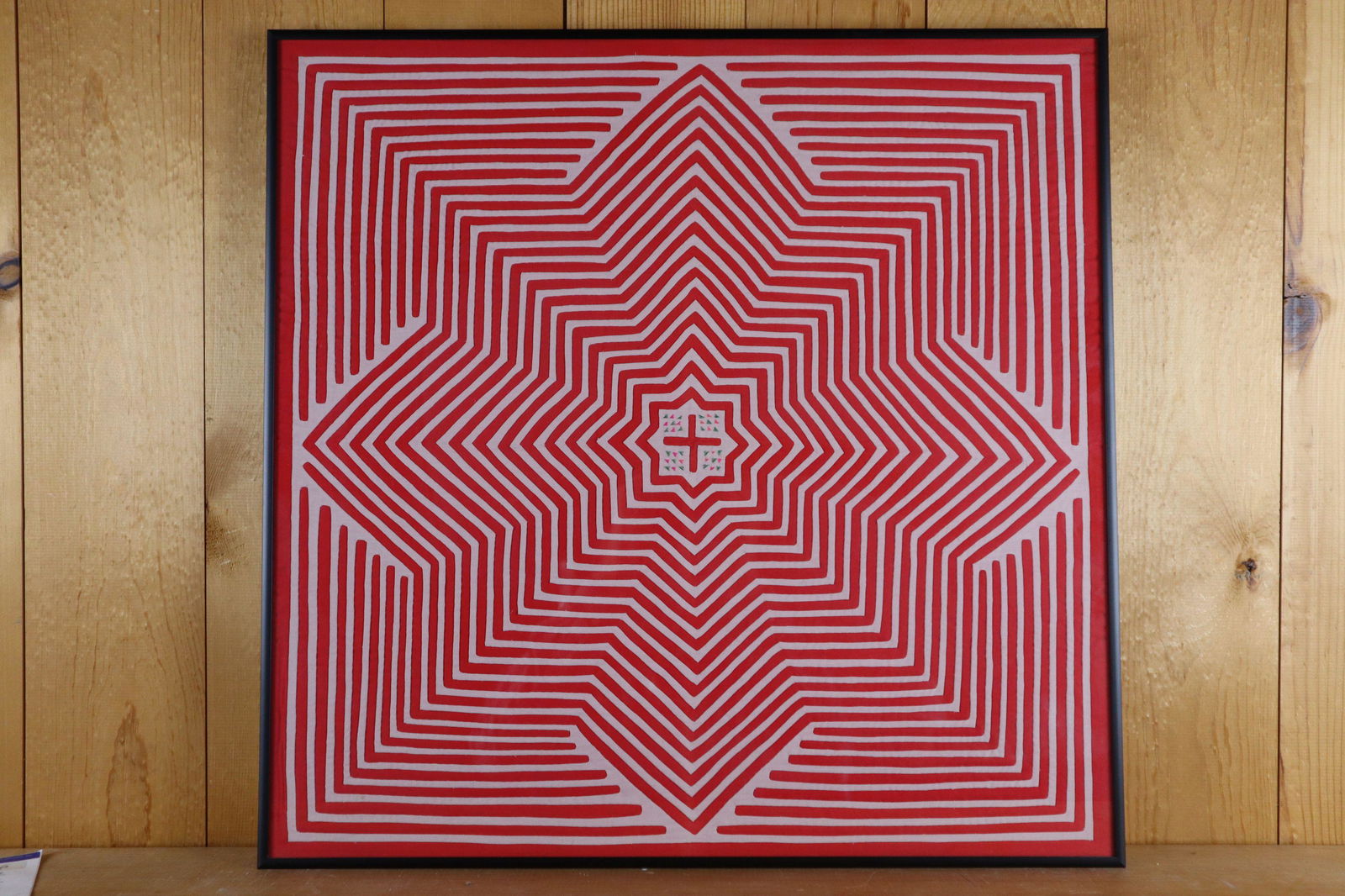 HAND STITCHED FRAMED ART, RED AND WHITE LINEN REPEATING STARBURST, WITH CENTER CROSS: Hand Stitched Framed Art, Red And White Linen Repeating Starburst, With Center Cross, Frame Size 22.5X22.25"H
