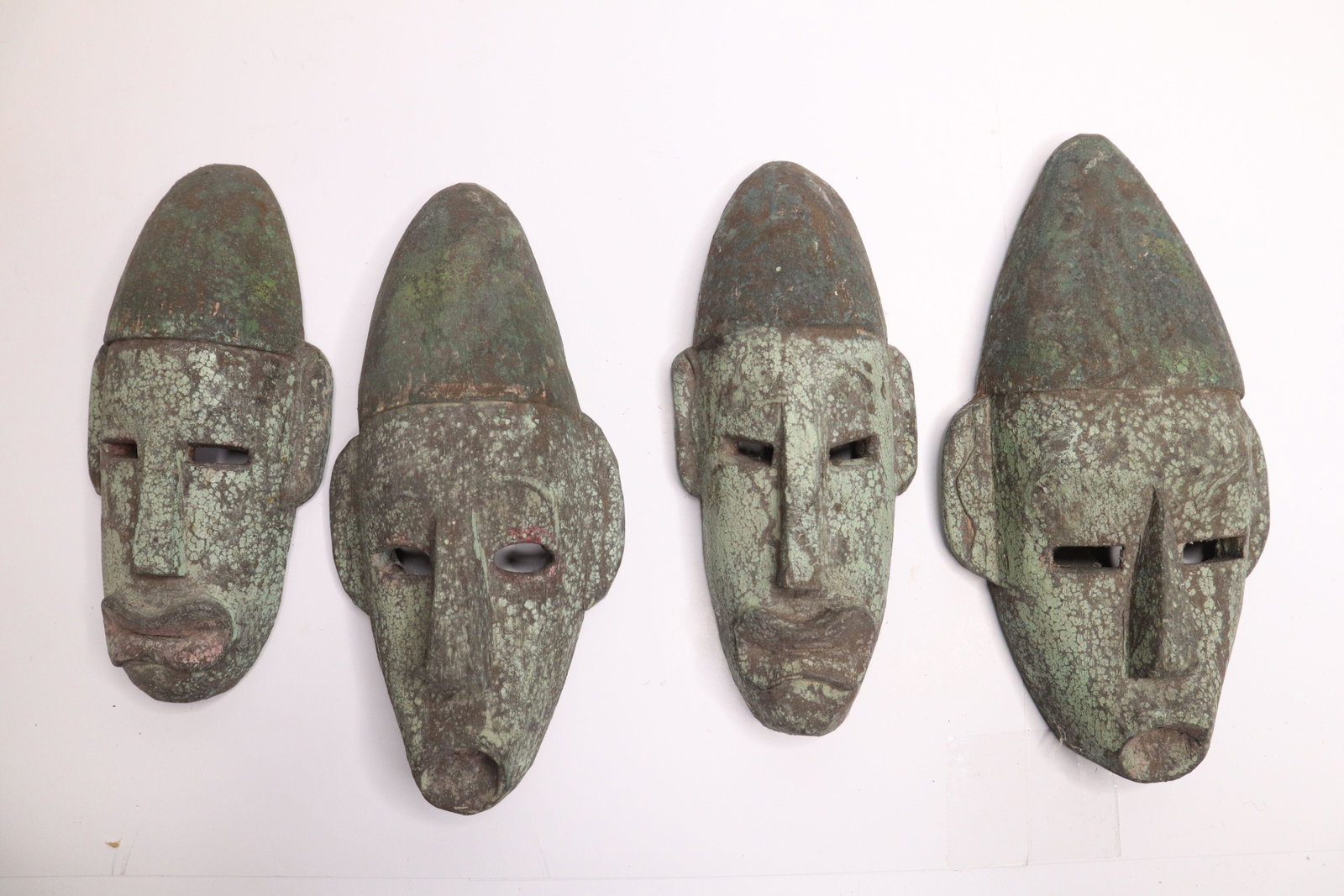 4 SMALL INDONESIAN CARVED WOOD MASK WALL HANGINGS, 5X9"H: 4 Small Indonesian Carved Wood Mask Wall Hangings, 5X9"H