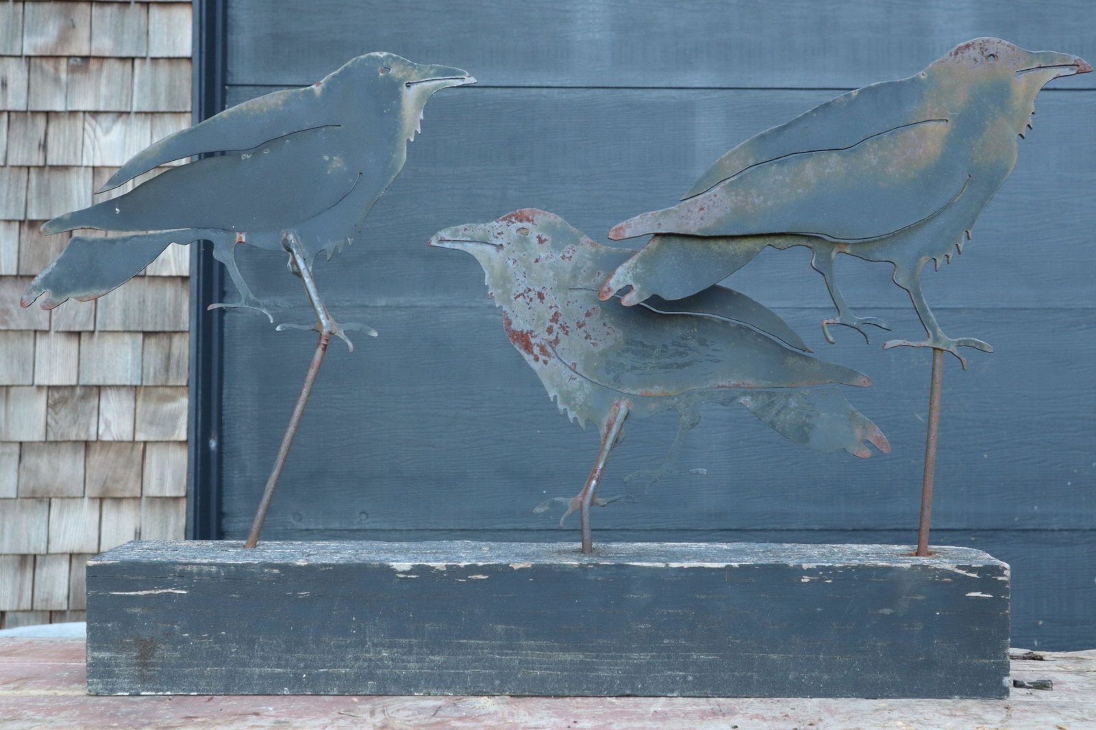 3 METAL CUTOUT CROWS MOUNTED ON A WOOD BASE, 24X3.5X17.5".: 3 Metal Cutout Crows Mounted On A Wood Base, 24X3.5X17.5".