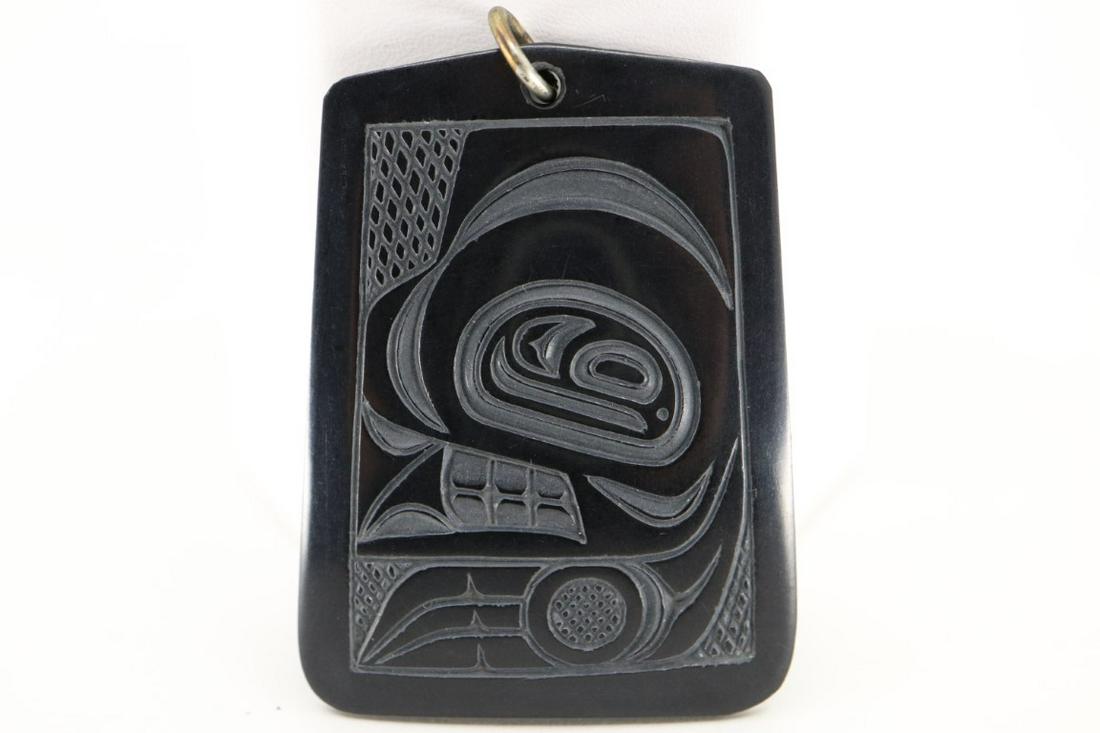 DENNY DIXON CARVED ARGILLITE PENDENT, HAIDA: Denny Dixon Carved Argillite Pendent, Haida 12/73, 1-3/4 x 1-1/4"