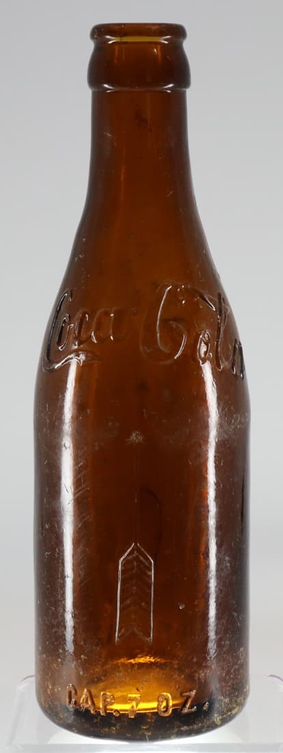 STRAIGHT SIDED AMBER GLASS COCA COLA BOTTLE CLEVELAND O., ARROW ON SIDE WITH COCA COLA SCRIPT ON (1 of 5)