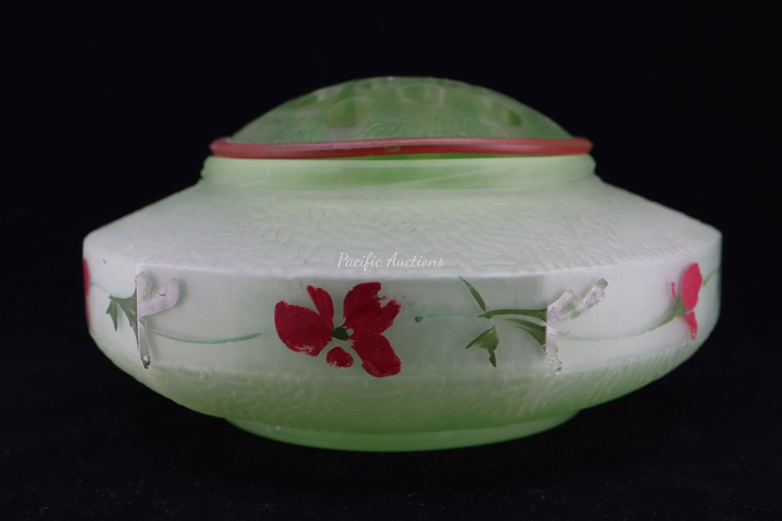 VINTAGE URANIUM GLASS FLOWER FROG, WITH RIPPLED PATTERN ON TOP AND BOTTOM AND HAND PAINTED RED FLOWE: DESCRIPTION: VINTAGE URANIUM GLASS FLOWER FROG, WITH RIPPLED PATTERN ON TOP AND BOTTOM AND HAND PAINTED RED FLOWERS ALONG SMOOTH EDGE, 8x4.25"H WEIGHT: CONDITION: Please see photos for condition. Cond