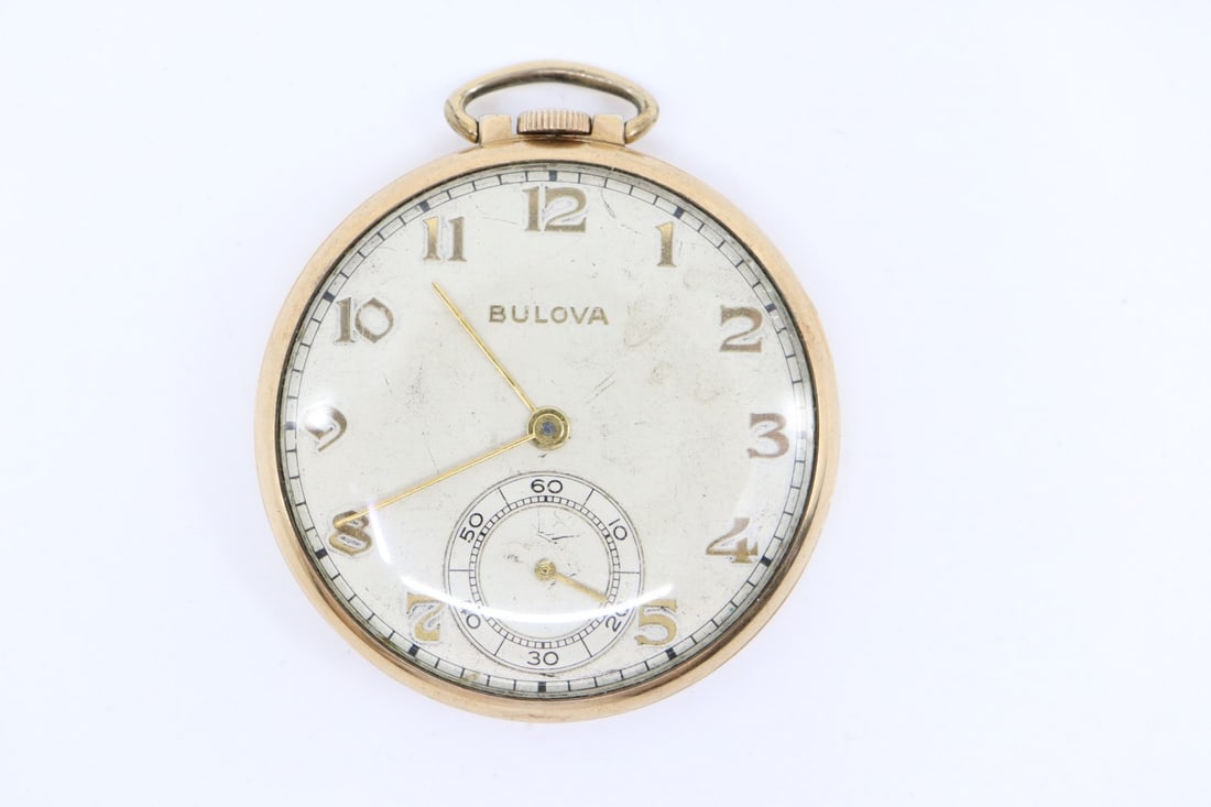 BULOVA WATCH CO. ART DECO POCKET WATCH, 17AK, 15 JEWELS, 10KT ROLLED GOLDPLATE: DESCRIPTION: BULOVA WATCH CO. ART DECO POCKET WATCH, 17AK, 15 JEWELS, 10KT ROLLED GOLDPLATE CONDITION: Please see photos for condition. Condition is commensurate with age and use. We aim to take addit