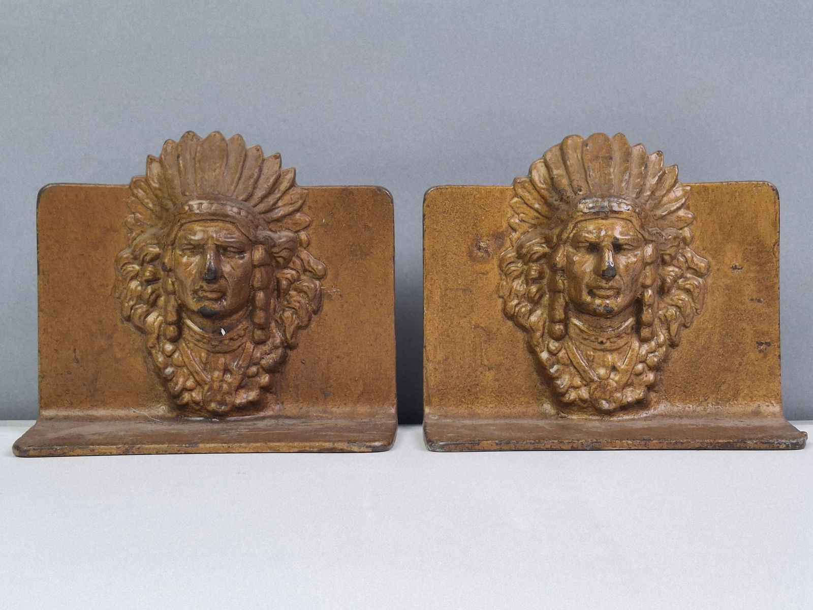 PAIR VINTAGE NATIVE AMERICAN INDIAN CHIEF CAST METAL BOOKENDS, 4.5": DESCRIPTION: PAIR VINTAGE NATIVE AMERICAN INDIAN CHIEF CAST METAL BOOKENDS, 4.5". CONDITION: Please See Photos For Condition. Condition Is Commensurate With Age And Use. We Aim To Take Additional Phot