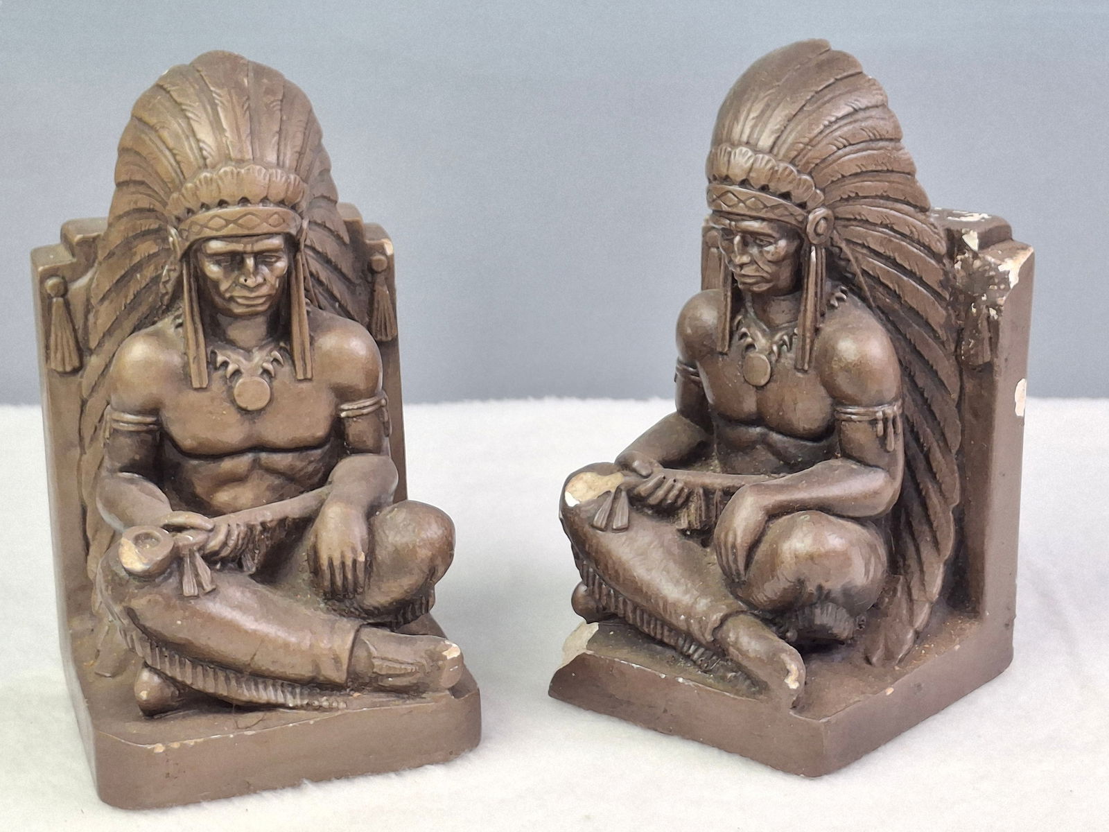 PAIR OF SITTING INDIAN CHALKWARE BOOKENDS: DESCRIPTION: PAIR OF SITTING INDIAN CHALKWARE BOOKENDS. CONDITION: Please See Photos For Condition. Condition Is Commensurate With Age And Use. We Aim To Take Additional Photos Of Any Noticeable Damag