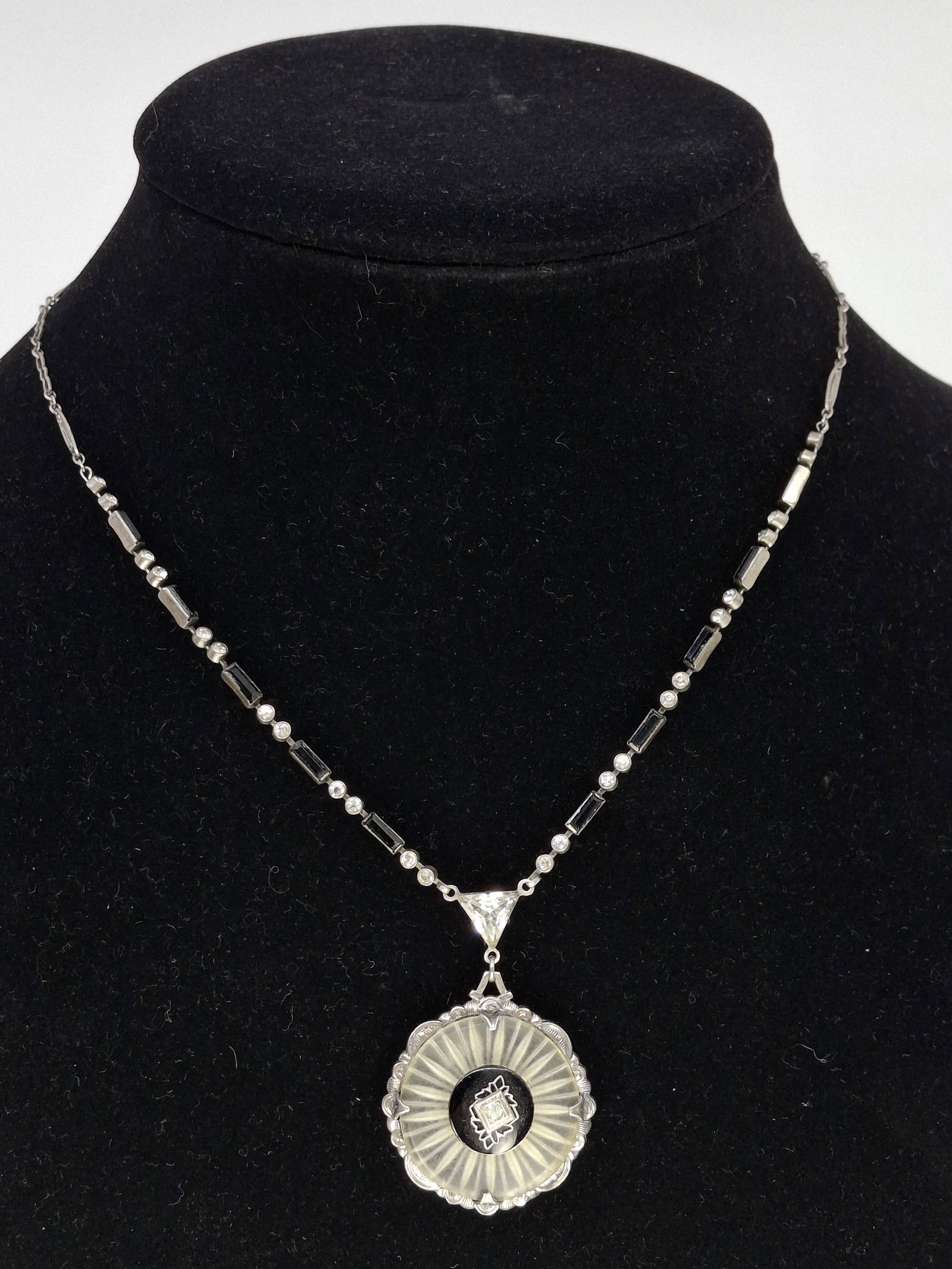 ANTIQUE STERLING SILVER ART DECO NECKLACE WITH CAMPHOR GLASS AND ONYX DISC CHARM: DESCRIPTION: ANTIQUE STERLING SILVER ART DECO NECKLACE WITH CAMPHOR GLASS AND ONYX DISC CHARM. CONDITION: Please See Photos For Condition. Condition Is Commensurate With Age And Use. We Aim To Take Ad