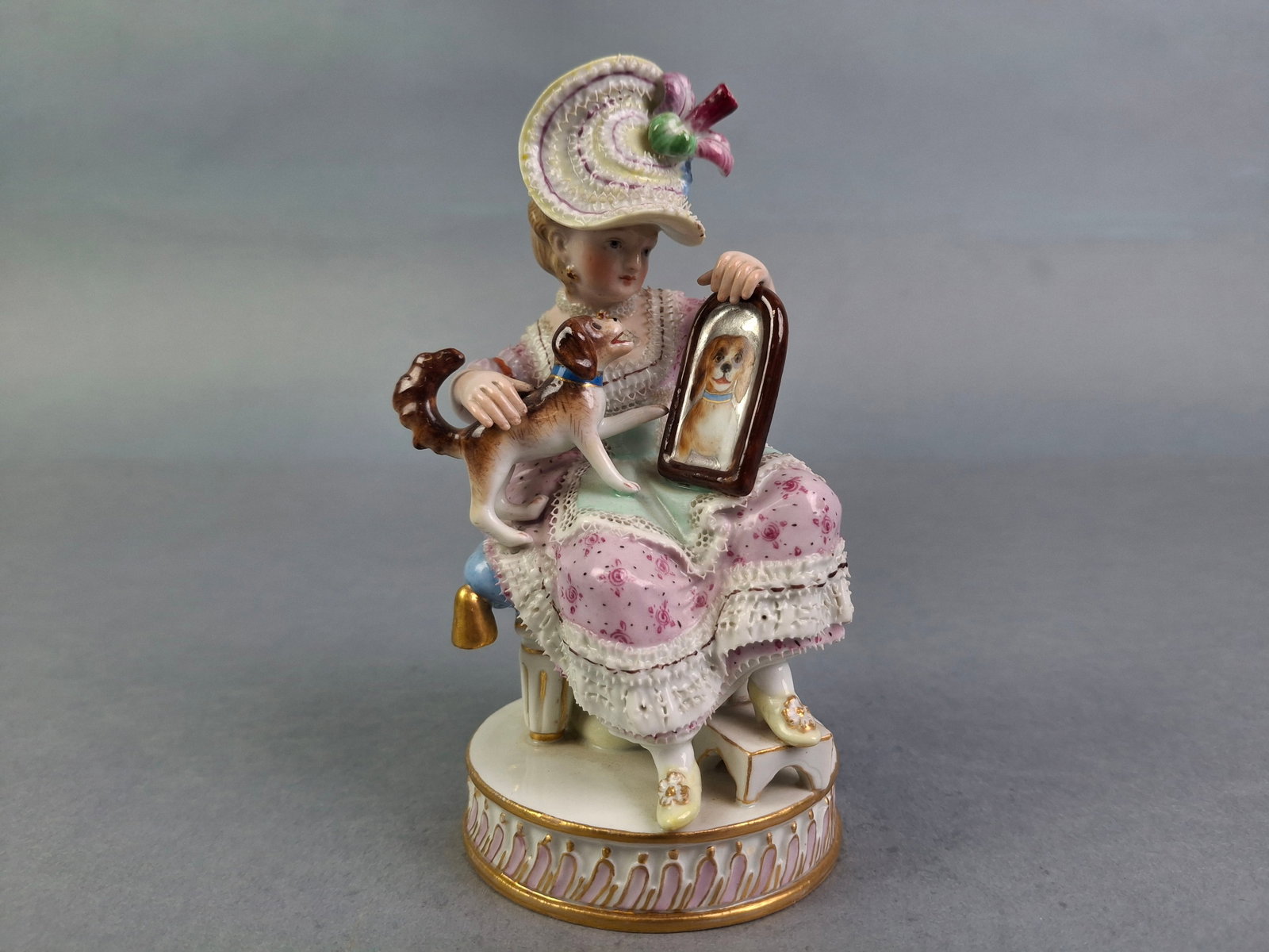 MEISSEN PORCELAIN FIGURINE, GIRL WITH DOG & MIRROR, 5-3/8"H, LOSS OF GOLDEN TASSLE ON REVERSE.: MEISSEN PORCELAIN FIGURINE, GIRL WITH DOG & MIRROR, 5-3/8"H, LOSS OF GOLDEN TASSLE ON REVERSE.