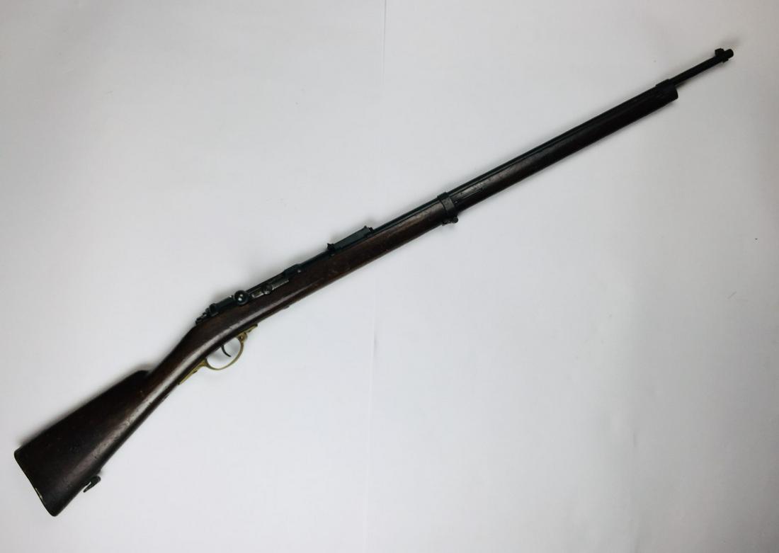 Rifle: Mauser Deudetau rifle. Serial number 90182. With regimental mark. PLEASE CONTACT US BEFORE BIDDING ON A FIREARM SO THAT WE CAN ESTABLISH ITS SHIPPING COST. ONLY PACKAGES OF 15 KILOGRAMS AND ABOVE WILL