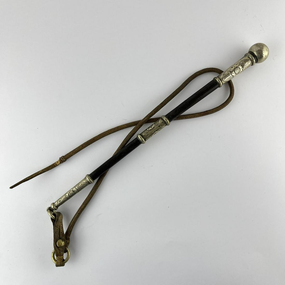 Baleen Crop: Baleen horsewhip handle with metal endcap, pin and toe-cap engraved with "leaves and flowers", ring marked "Hunter" by J.M. Mailhos and fine braided leather sockets.
