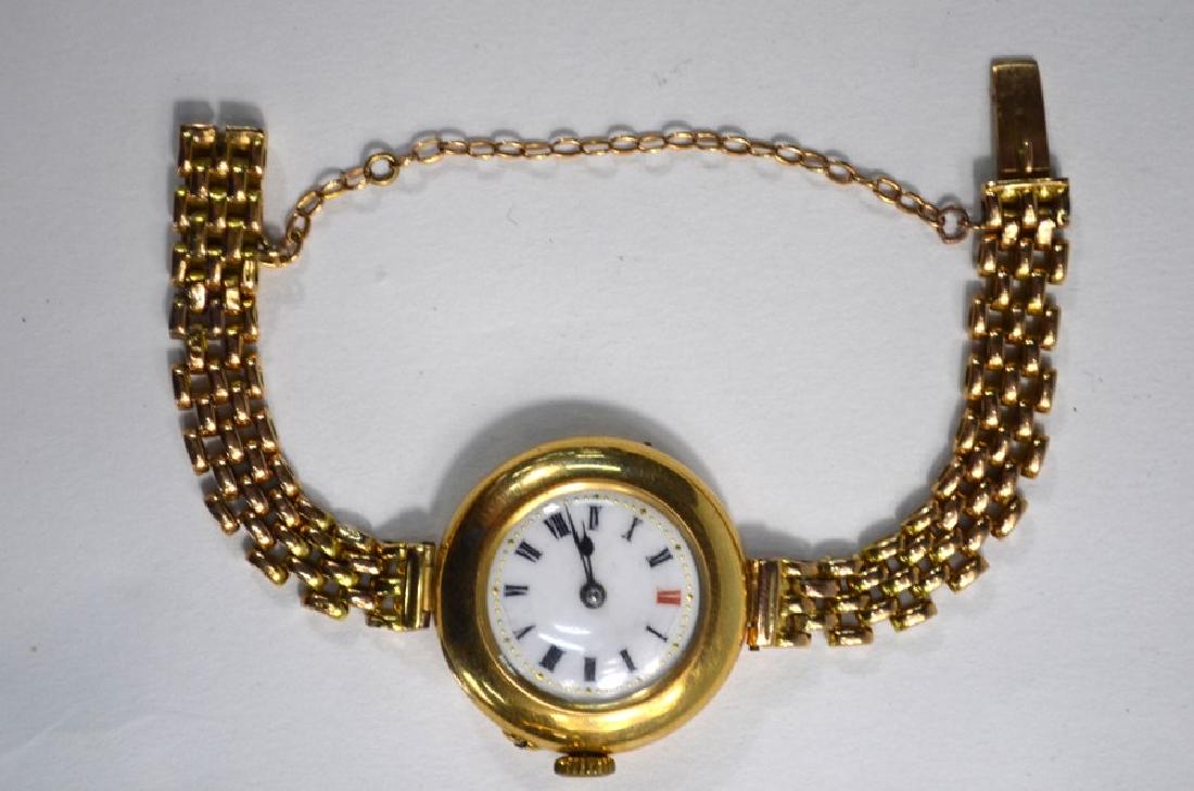 An Edwardian 15ct gold wristwatch: An Edwardian 15ct gold wristwatch with Swiss movement and enamelled dial within broad bezel, on brick-link chain bracelet, 27.5g gross weight