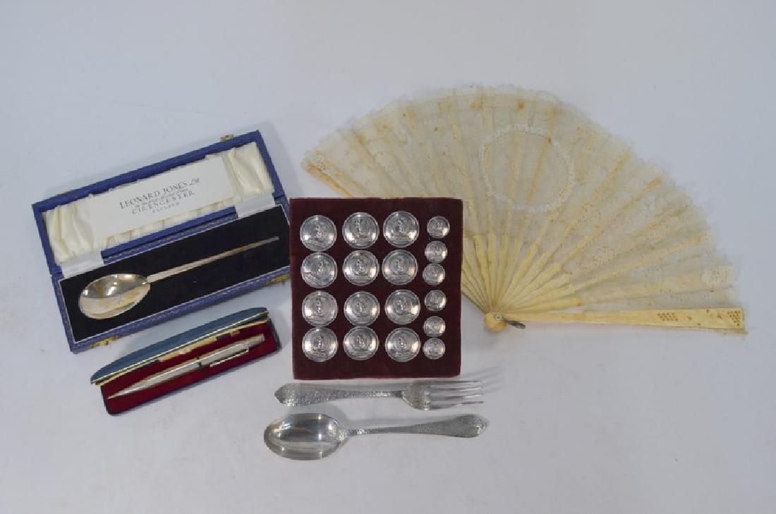 A Georgian carved bone fan with lace leaf, buttons and: A Georgian carved bone fan with lace leaf, to/w a set of twelve electroplated livery buttons with squirrel crests with six matching cuff-buttons, by Firmin & Sons of London, a Victorian silver christe