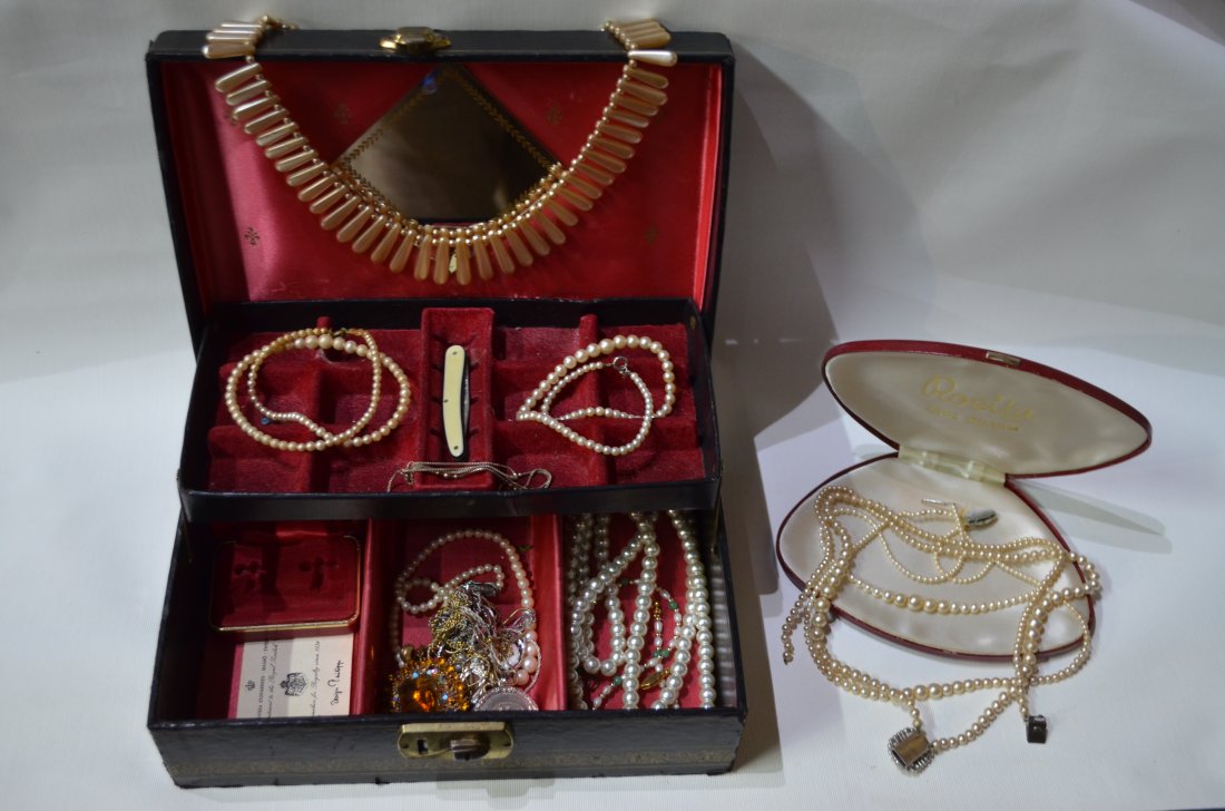 A black jewel box containing a quantity of cultured and: A black jewel box containing a quantity of cultured and simulated vintage pearl necklaces, gilt metal chains, paste set pendant etc
