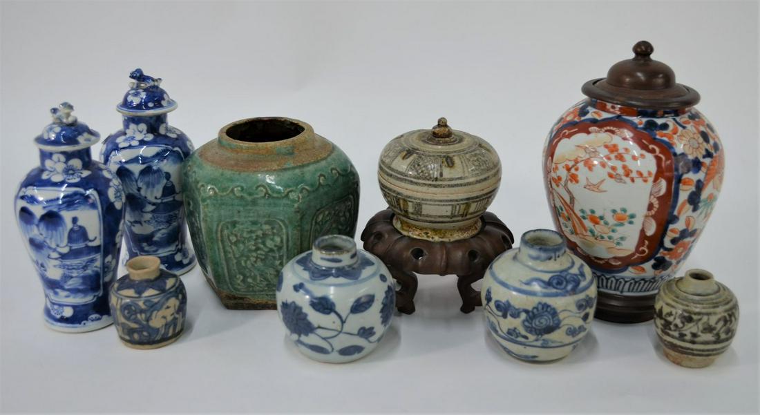 A small collection of 16th century and later Asian: A small collection of 16th century and later Asian ceramics including; three small Ming period blue and white brush pots, two Sawankhalok stoneware pots, a provincial hexagonal stoneware jar with gree