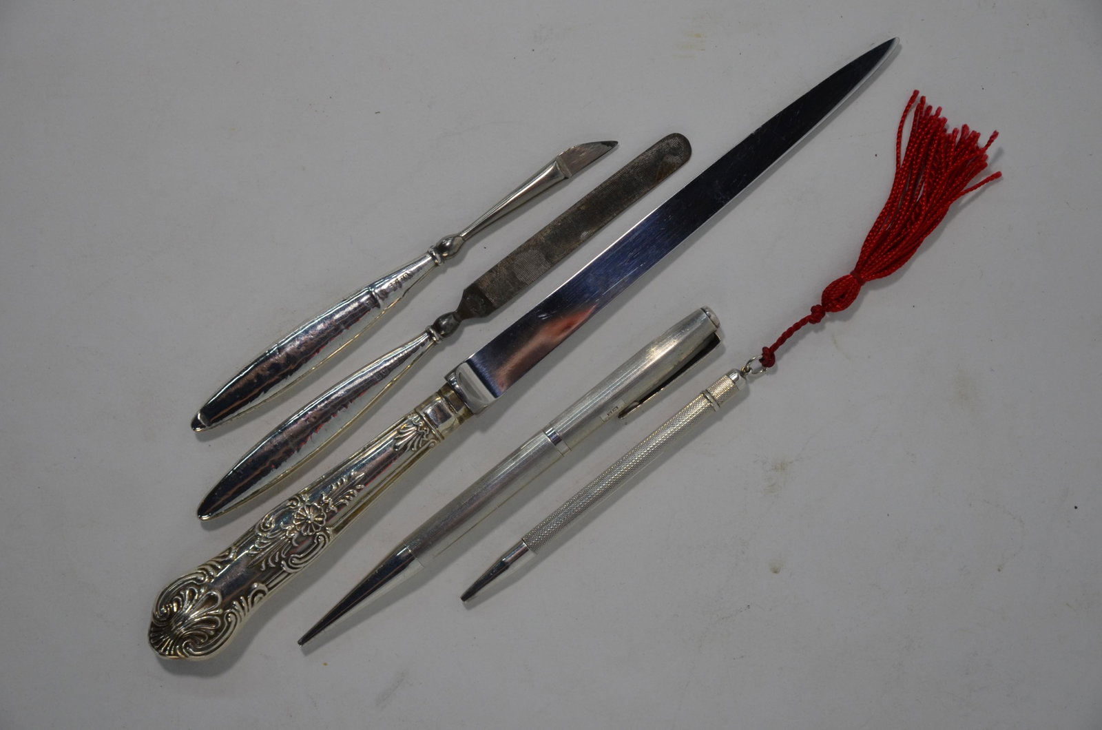 Silver 'Yard-O-Led' propelling pencil and four other: A silver 'Yard-O-Led' propelling pencil, Birmingham 1964 to/w a silver handbag-pencil, Birmingham 1983, a paperknife with loaded king's pattern handle, Birmingham 1988 and two silver-handed manicure t