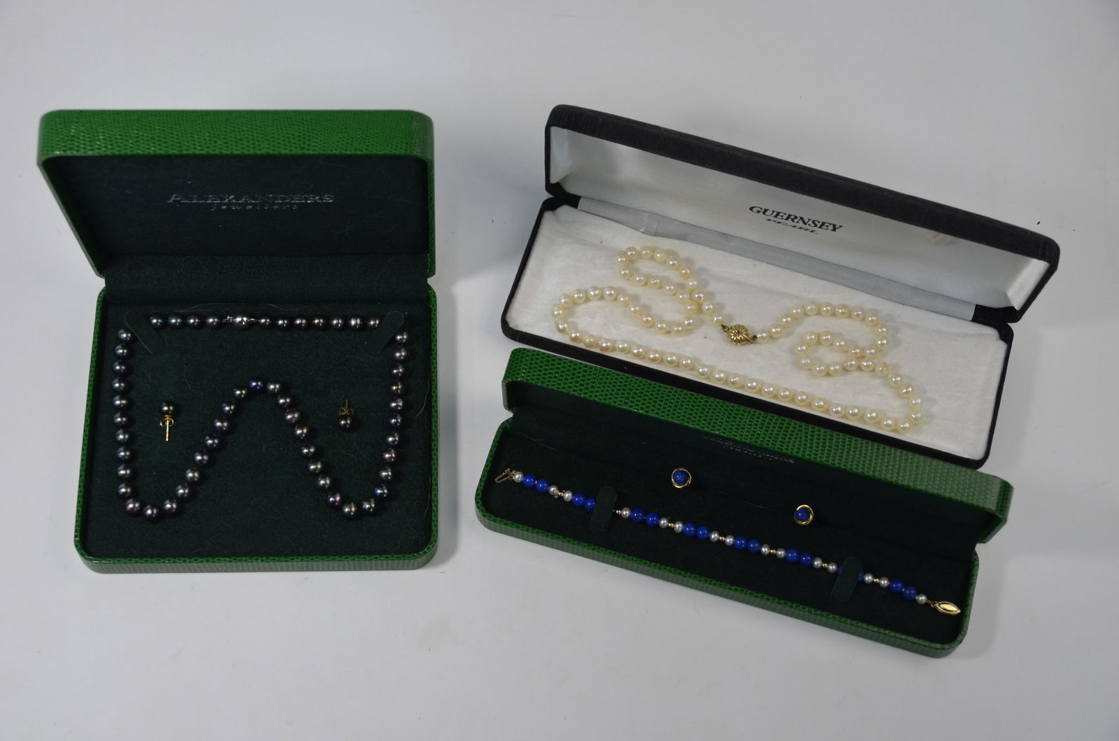 WITHDRAWN A lapis lazuli and pearl bead bracelet: WITHDRAWN A lapis lazuli and pearl bead bracelet on yellow metal snap stamped 14k to/w pair of lapis lazuli stud earrings set 9ct yellow gold to/w black pearl necklace and earrings and a row of Guerns