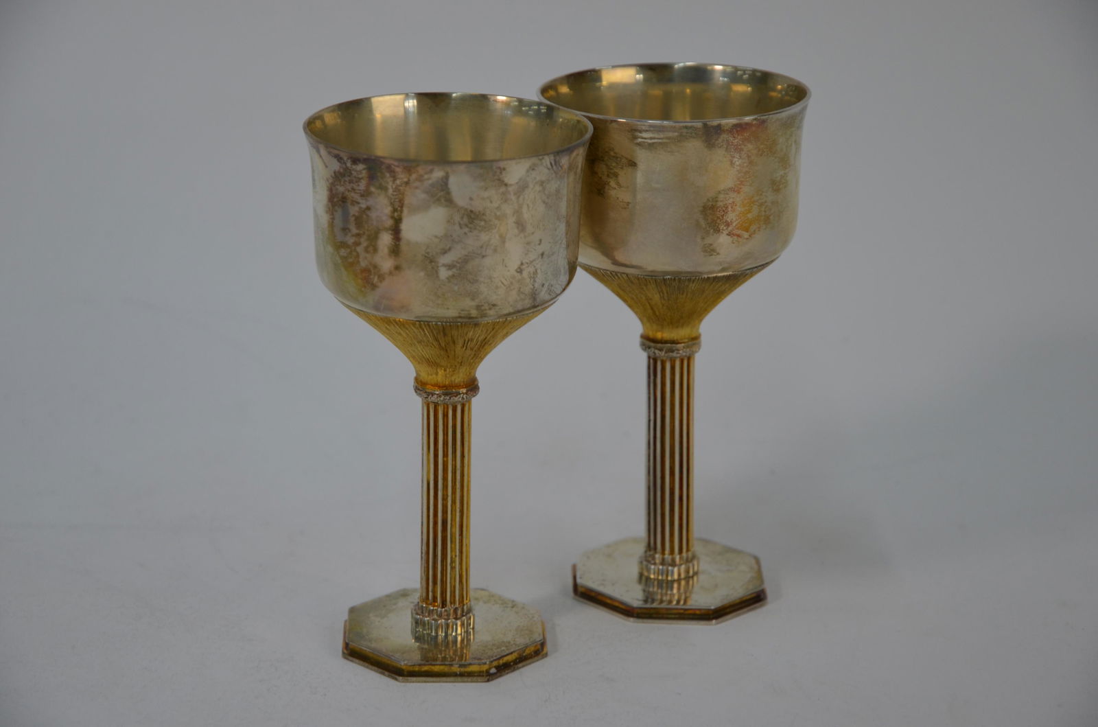 Pair of silver Wells Cathedral goblets: A boxed pair of contemporary design parcel gilt silver goblets - Wells Cathedral 8th Centenary commemoratives - Wakely & Wheeler, London 1978, 11oz, 13.5cm, ltd. ed. nos. 58A/58B (of 800), c/w Certifi
