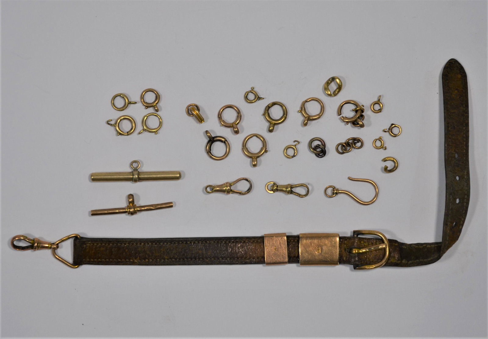 A quantity of unmarked bars, swivels and rings: A quantity of unmarked bars, swivels and rings, approx 20.5 g to/w 9ct watch strap fittings etc