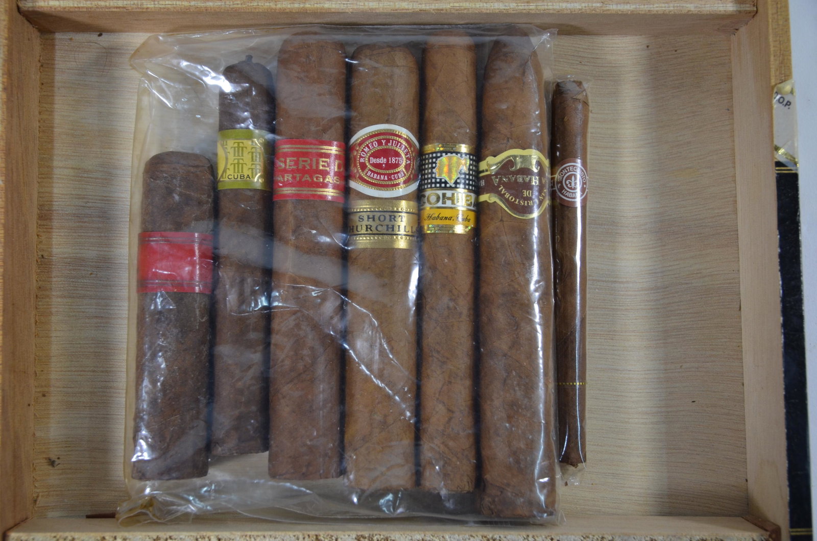 Two Cuban Partagas cigars: Two Cuban Partagas cigars, Vintage H & F 1999 and Edicion Limitada 2014 to/w six other cuban cigars, a Montecristo cheroot, etc (note these cigars have been carefully stored, with annual spray of cogn