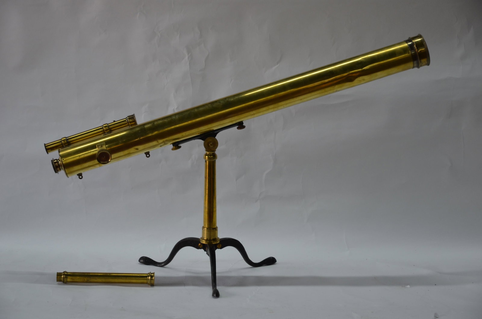 A 19th century large brass astral telescope on folding: A 19th century large brass astral telescope on folding tripod, with secondary sighting scope and original box, by Newton & Co, Fleet Street, London, 132 cm long overall