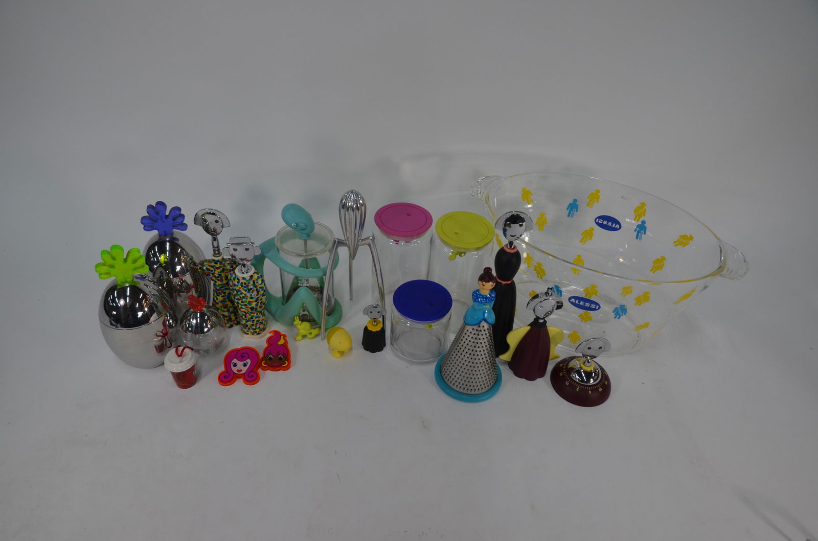 A collection of various Alessi kitchenalia: A collection of various, mostly unused modern Alessi kitchenalia including three 'Gianni holding on tight' hermetic storage jars designed by Mattia Di Rosa (yellow pink and blue) a press filter cafeti