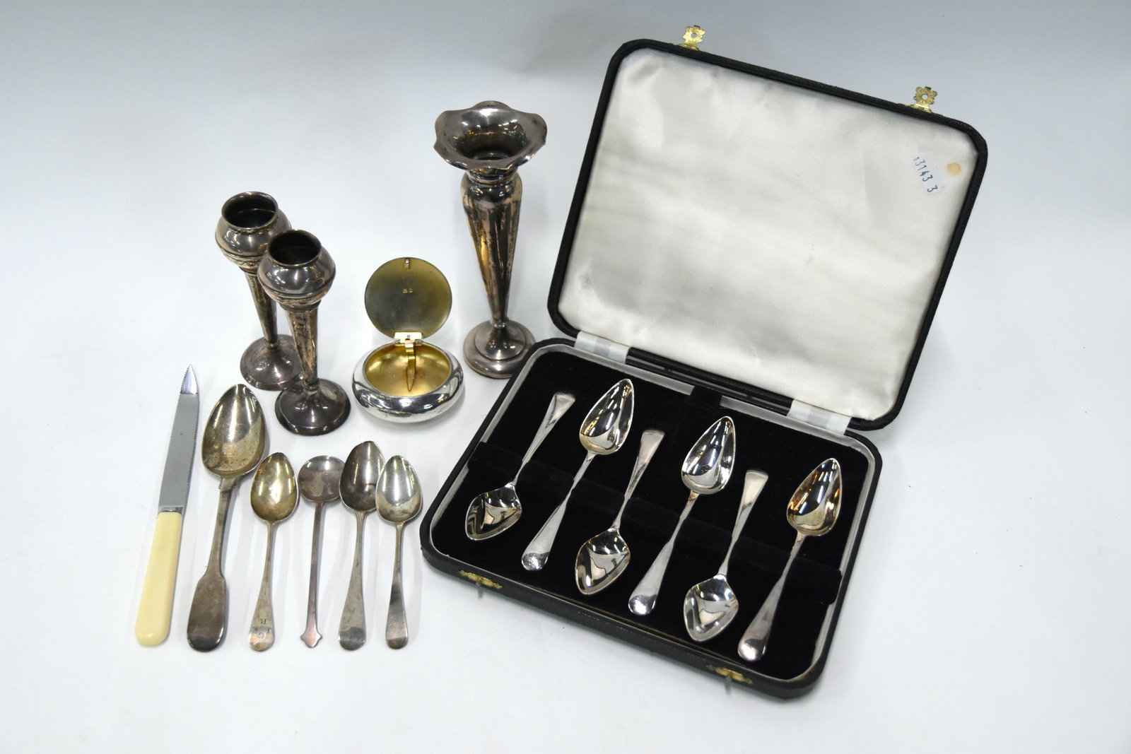Edwardian silver: An Edwardian silver 'pebble' snuff box, Henry Williamson Ltd., Birmingham 1907, to/w a George III fiddle pattern dessert spoon, Josiah and George Piercy, London 1813, four Georgian and later small sil