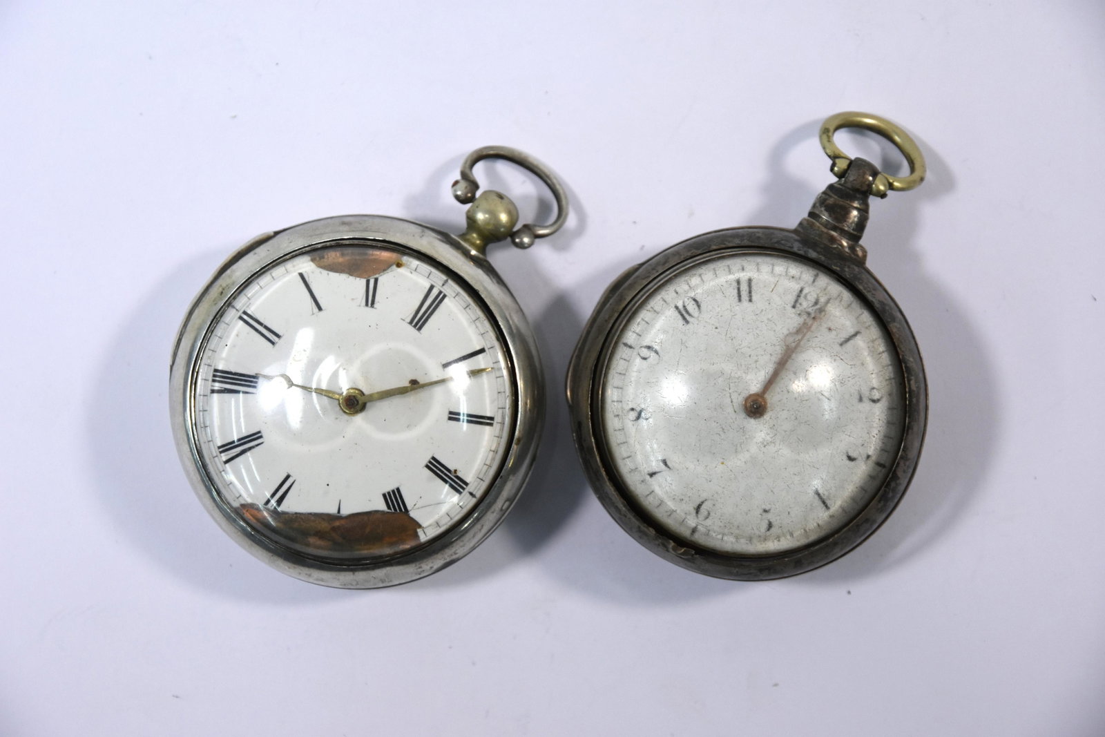 Two Georgian silver pair-cased pocket watches: A George III silver pair-cased pocket watch with verge and fusÃ©e movement no.7802 by Ollive & Reader of Cranbrook, the cases 1808, to/w a George IV silver pair-cased pocket watch with incomplete ve