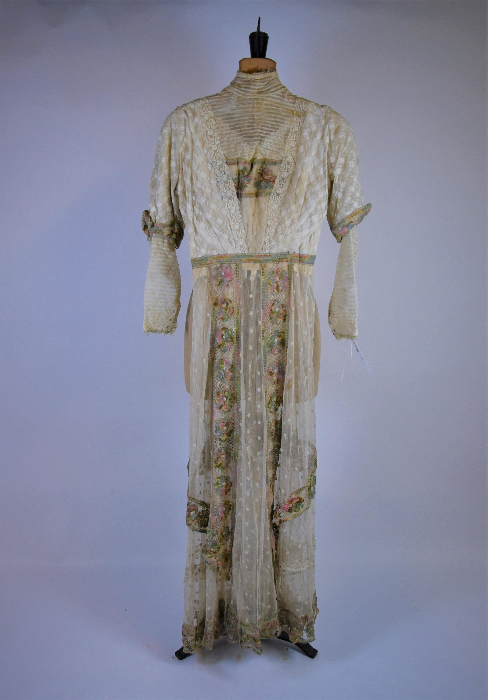 An Edwardian lady's summer tea dress: An Edwardian lady's delicate summer tea dress, the cream gauze dress with crochet lace and embroidered panels, ribbed gauze high neck and long sleeves