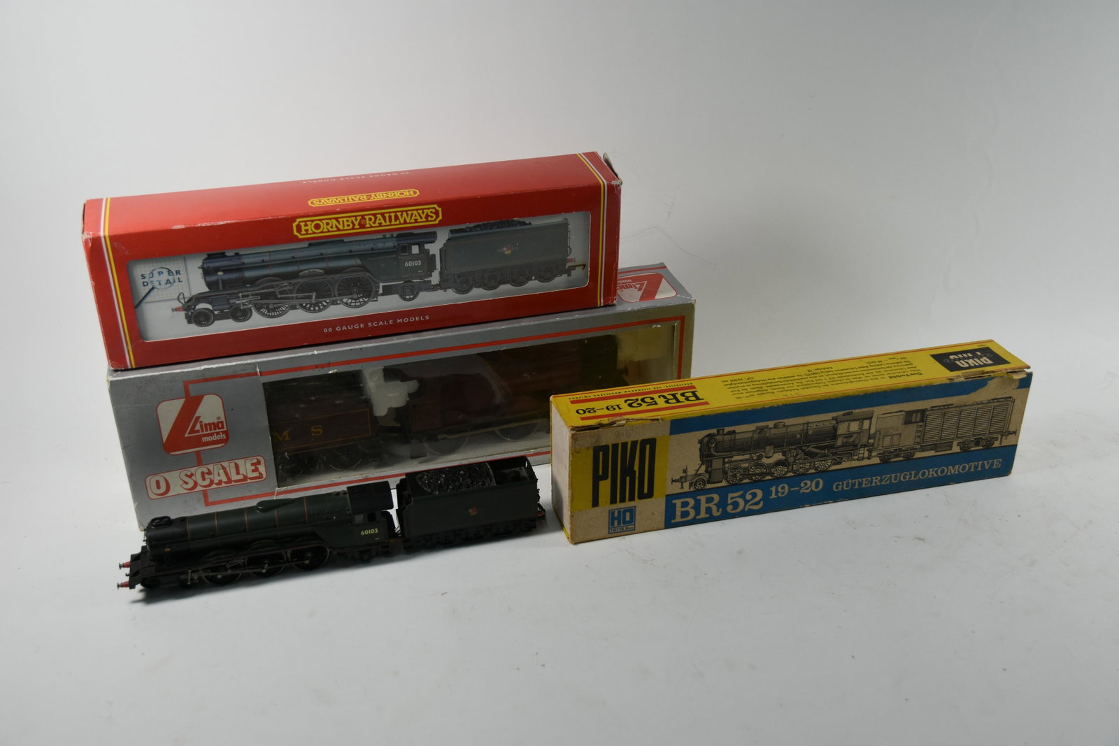 Collection of various locomotives: A Piko HO gauge BR52 19-20 GÃ¼terzuglokomotive (boxed), to/w a Hornby Railways 00 gauge R2054 BR4-6-2 Class A Locomotive 'The Flying Scotsmen' (boxed) and a Lima Model '0 scale' 0-6-0 locomotive and