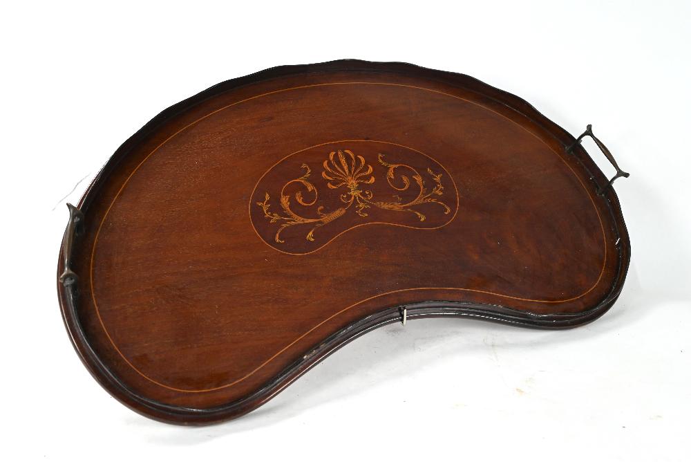 A Victorian inlaid satinwood kidney shaped tray: A Victorian inlaid satinwood kidney shaped tray with wavy top gallery and brass handles