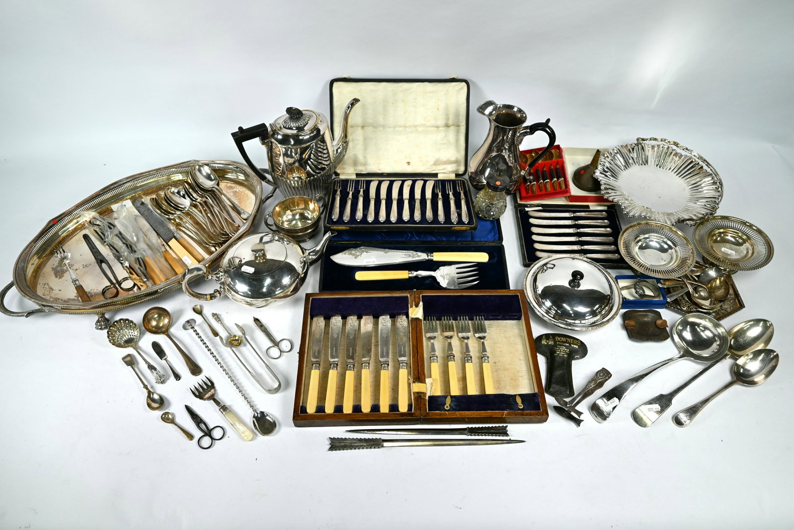 EPNS tray and various tableware, etc.: An epns two-handled oval tray with pierced gallery, to/w a compressed melon tea pot, half-reeded coffee pot, plated on copper jug (possible Danish design), various flatware, etc.