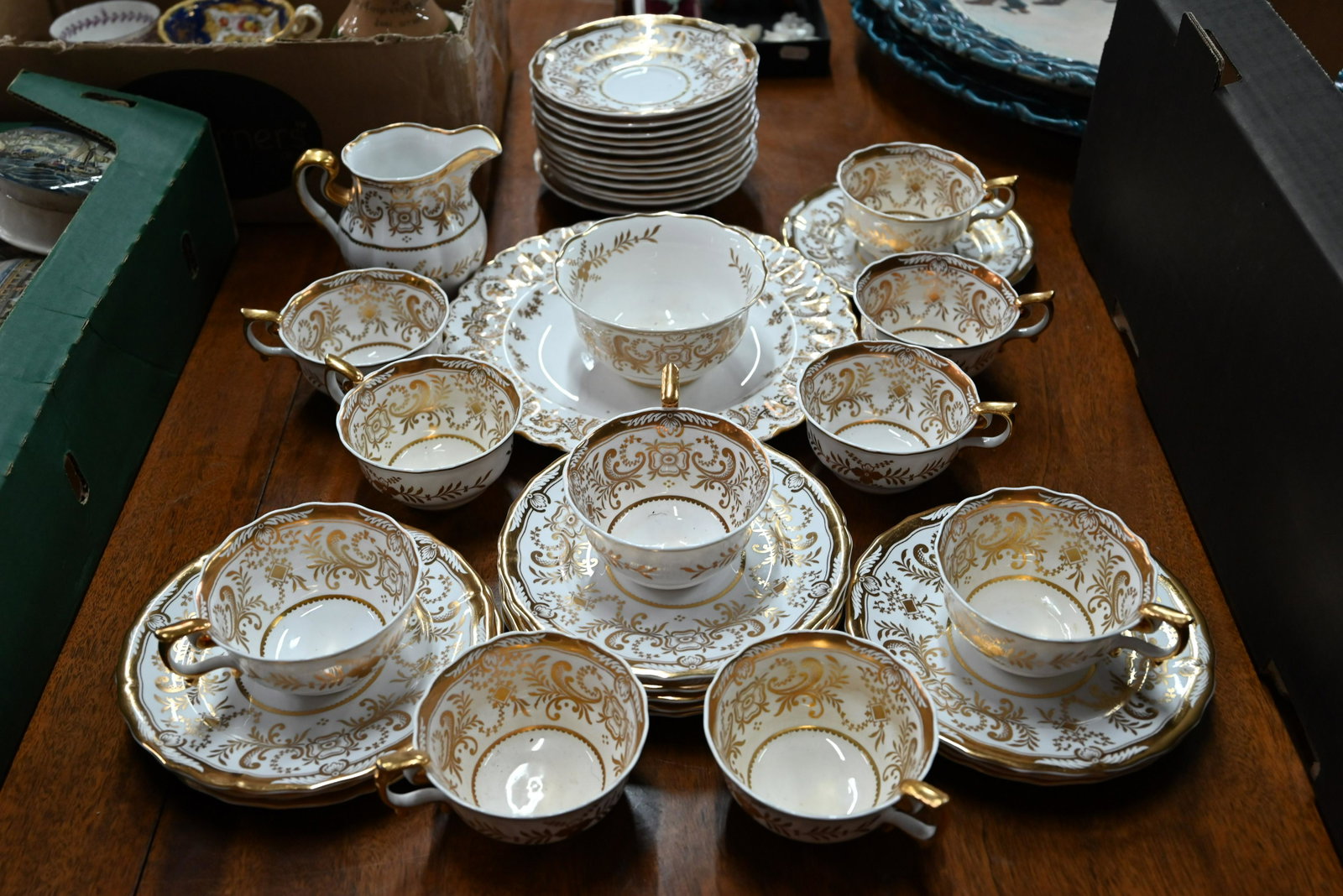 Late Victorian Copeland Spode tea service: A late Victorian Copeland Spode tea service with gilt decoration 'Spode's Period 1820-1830', comprising ten cups and saucers, twelve plates and milk and sugar pair