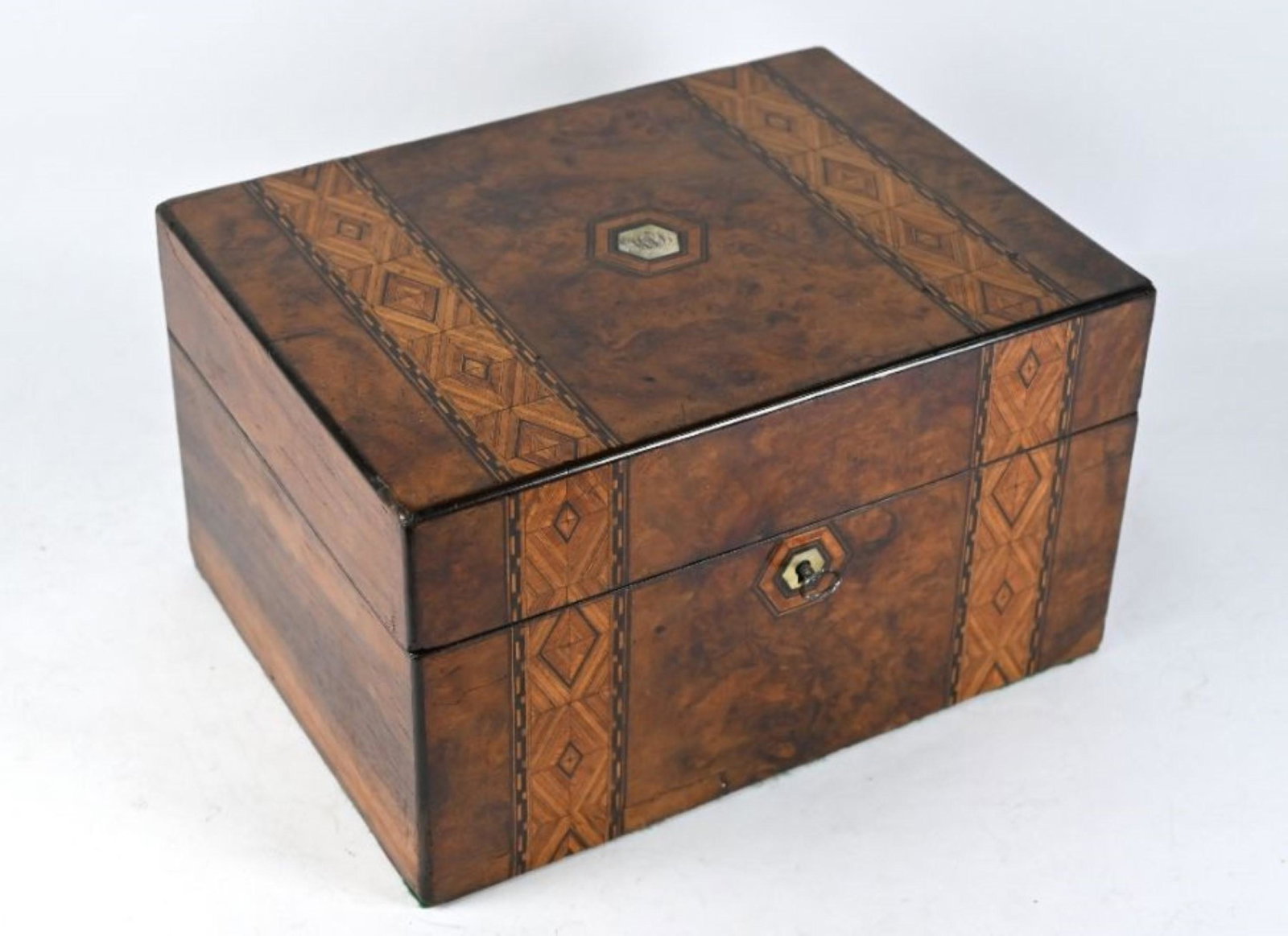 Victorian walnut toilet case with electroplated: A Victorian walnut and parquetry-inlaid toilet case, the blue-velvet lined interior fitted with six glass bottles and jars with plated on copper tops, sprung drawer to base, 30cm wide Buyers premium 3