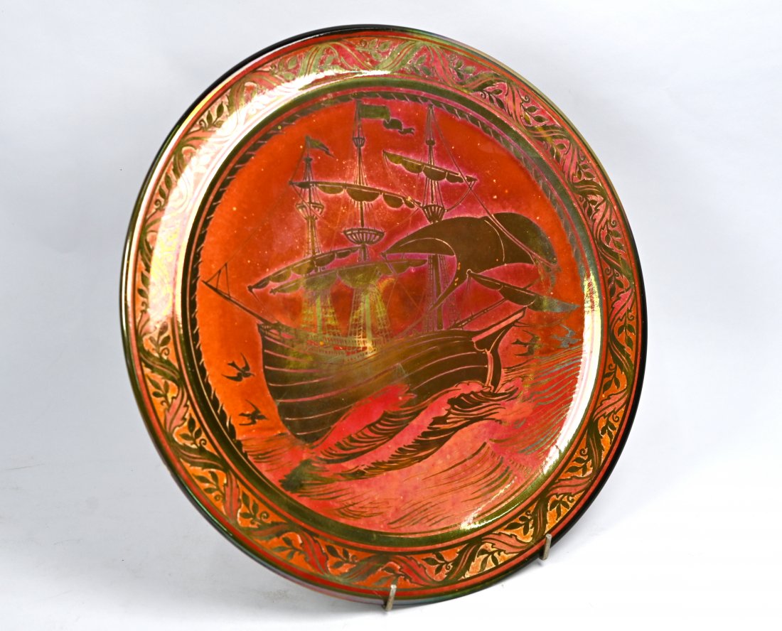 A Royal Lancastrian pottery charger: A Royal Lancastrian pottery charger, decorated in copper resist with a galleon in full-sail, Richard Mycock, 1924, 32 cm bears 1980 Richard Dennis Exhibition label verso, item 55
