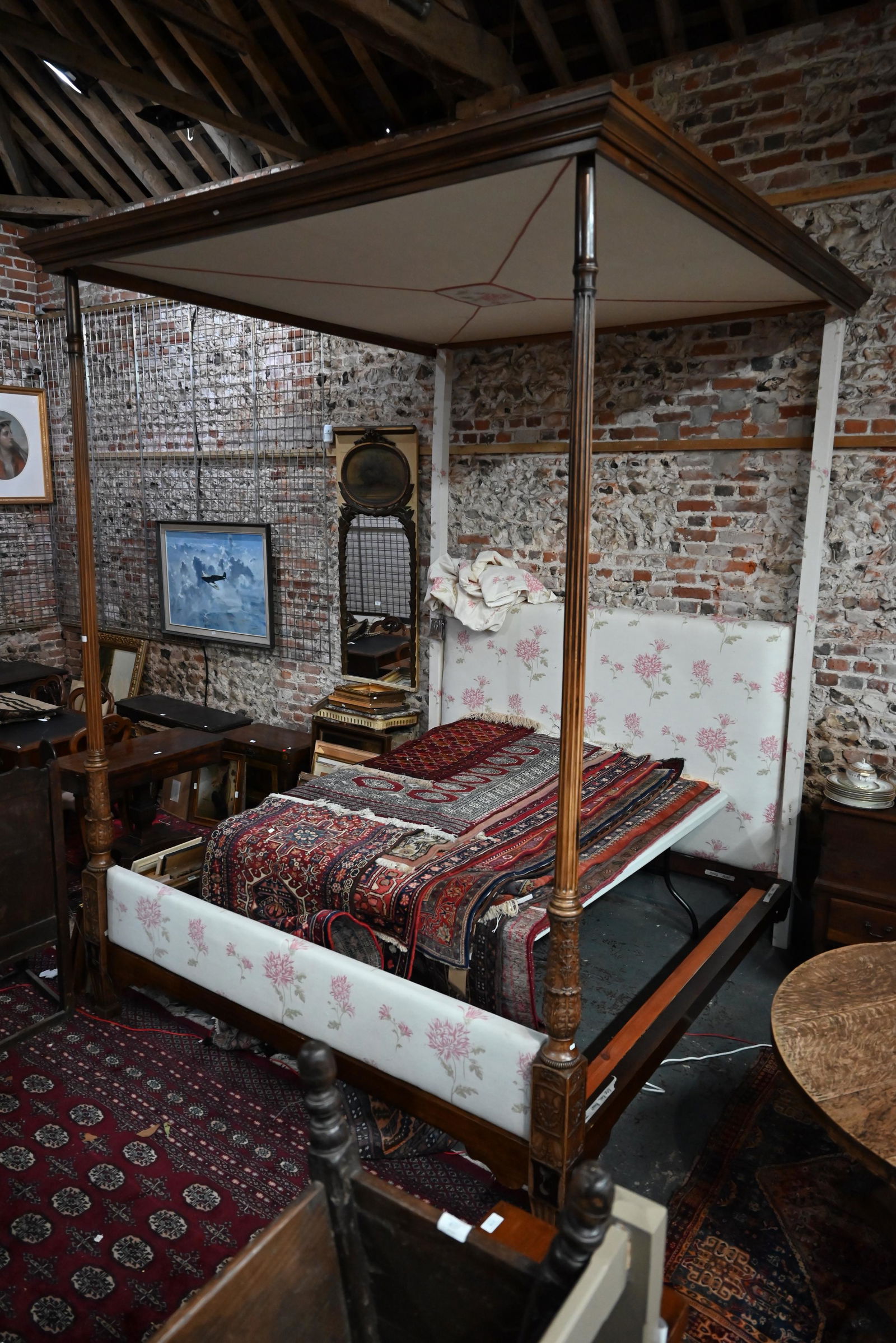 A George III and later Adam style mahogany four poster: A George III and later Adam style mahogany four poster bed canopy bed, dressed with floral stencilled linen panels head and foot boards, with conforming pelmet, approx. 230 cm long x 217 cm w x 293 cm