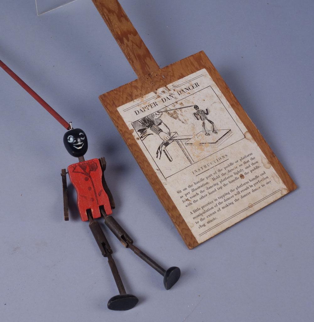 Vintage Dancing Dan Folk Art Daning Figurine Toy: A vintage wooden Dancing Dan toy with doll and paddle Paddle: 23" long doll: 8"