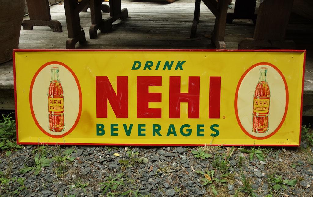 Nehi Metal Advertising Sign: A large advertisement for Nehi beverages. depth is on turned edges top and bottom 53.75" x 18" x 0.75"