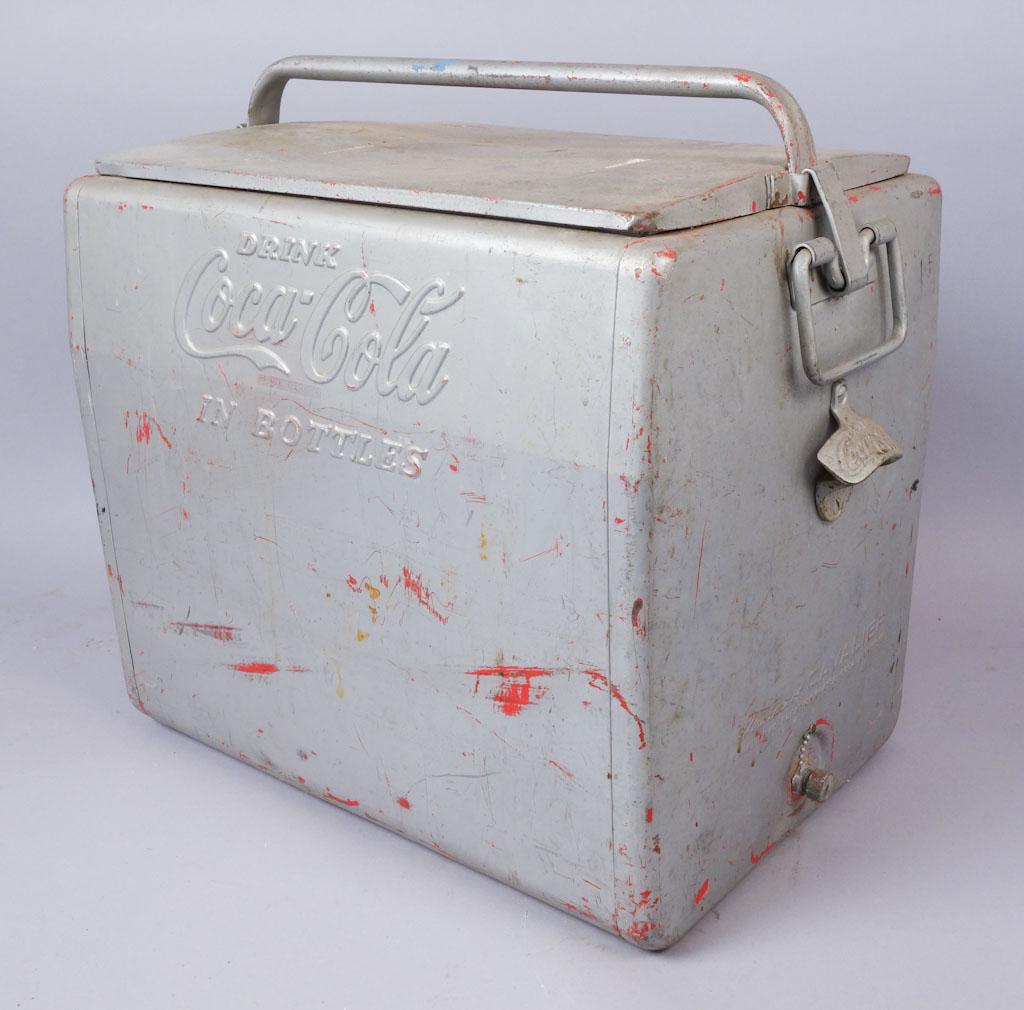 Vintage Coca-Cola Advertisting Ice Chest Cooler: A Coca Cola branded cooler from the Cavalier Corporation. This piece is missing most of its original paint, and the bottom is severely rusted. 18" x 12.50" x 18.50" (lid on)