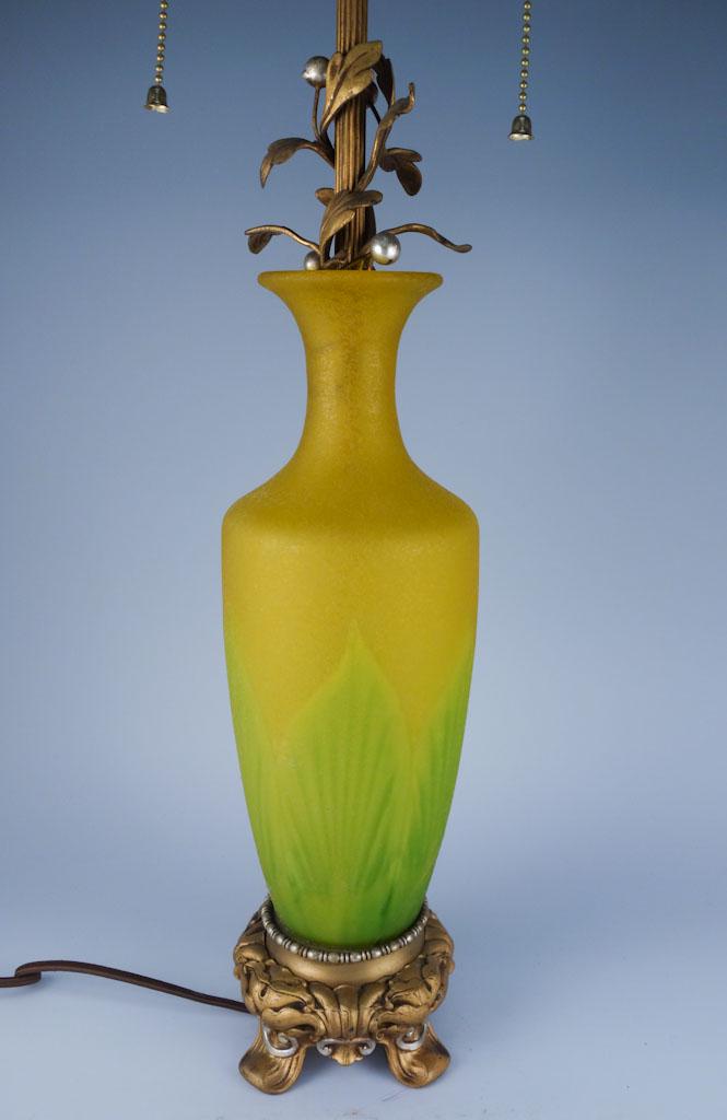 Pulled Feather Internally Decorated Lamp: This is a large Steuben lamp with an internally decorated glass stand in yellow and green. The glass is cracked in two fragments along the lower edge on one side. 27.5"