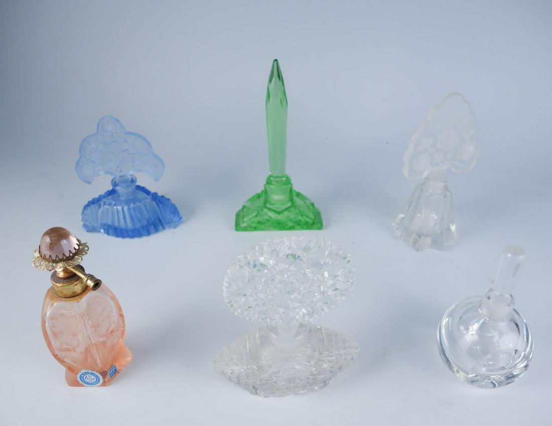 Lot 6 Vintage Glass Perfume Bottles: Lot of 6 vintage glass perfume bottles. Blue bottle, green bottle, and clear bottle with floral stopper are labeled "Made in Czechoslovakia." The pink bottle has a "Made in Japan" sticker. The clear r