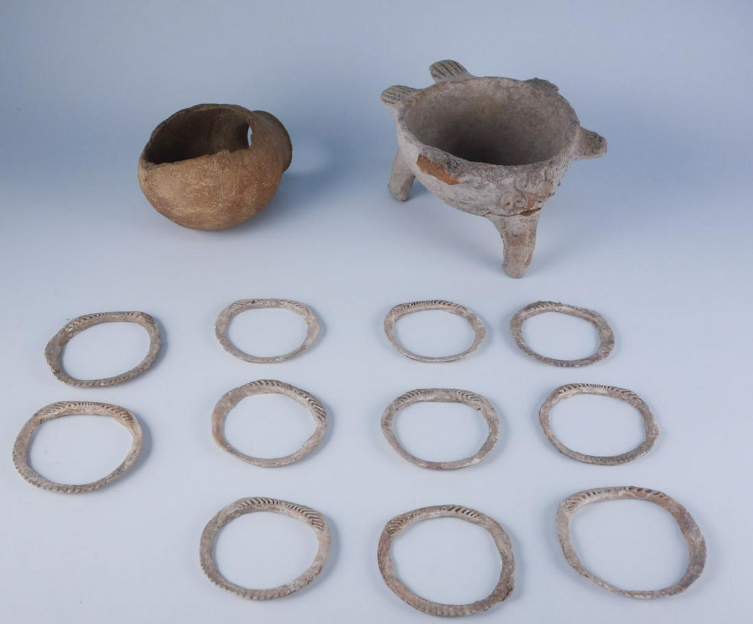 Lot Pre-Columbian Pottery with Appraisal: A lot of Pre-Columbian pottery, including 11 bracelets, 1 footed bowl, one vessel, and an appraisal. The lot of 11 bracelets and the footed bowl were appraised for $600 in 2003. Bowl: 6 1/4" widest po
